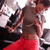 A person in a gray crop top and red pants stands with arms crossed, shifting posture across frames.