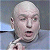 Pixelated close-up of a bald person with light skin, closed eyes, and an open mouth against a blurred background.