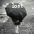 A grayscale animated icon shows a dark umbrella with white text changing across frames: 'lost', then 'and', then 'alone' over a textured background.