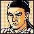 Pixelated static icon of a person with black hair and orange skin tones against an orange-and-white checkered background, wearing a white and black patterned garment.