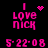 Pixelated pink text "I LOVE NICK" with date "5-22-08" on black background, featuring animated heart and starburst symbols.