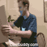 Animated sequence showing a person in a blue shirt with white logo interacting at a desk, performing gestures like clapping and covering face.