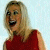 A pixelated contact sheet showing two frames of an animated icon featuring a woman in a red dress on the left and green text reading "Original Icons .com" on the right against a light background.