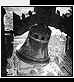 Black-and-white animated bell icon with subtle motion, framed by decorative architectural elements.