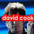 A pixelated image of a person with light-colored hair against a blue background, featuring overlaid text elements in red, blue, and black.