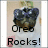 A pixelated dog wearing dark sunglasses with text 'Oreo Rocks!' and a changing heart symbol below.