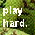 Pixelated green and brown background with white text reading 'play hard.' in two lines.
