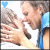 Animated contact sheet showing two frames of a cartoon couple kissing with blue heart symbols above them on a white background.
