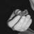 A grayscale pixelated icon shows a rounded object with a diagonal line across its surface against a dark background.