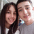 Two people pose closely together on the left side of a pixelated image, with text and symbols on the right.