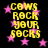 Yellow pixelated text 'COWS ROCK YOUR SOCKS' repeated four times on black background with pink stars, static image.