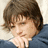 A pixelated image shows a person with brown hair resting their chin on a hand against a light background, next to a bright pink with white text reading "josh + lauren"
