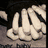 Four distinct pixelated images arranged in a : skeletal hands, a heart on sand, a fiery figure, and text reading "Melissa & Andrew" with a heart symbol