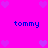 A static pixel art image with a bright pink background, purple hearts scattered around the edges, and four instances of blue text reading 'tommy' arranged in two