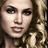 Pixelated close-up of a person with light skin tone, dark eyes, and brown hair wearing a patterned top against a blurred background.