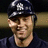 Pixelated image of a person wearing a dark cap with a silver emblem, next to blue pixelated text reading "Mrs. Riss Rose Jeter<3" on a white background.