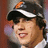 Pixelated image of a person wearing a dark cap with white stripe and orange detail, green text 'Babe <3333' on right side.
