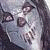 Pixelated static image of a person's face with dark hair and light skin tones, rendered in low-resolution grayscale with visible dithering and compression artifacts.