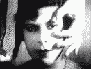 A black-and-white animated sequence shows a person with dark hair holding a cigarette, transitioning from close-up to side profile while exhaling smoke.