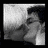 Black-and-white pixelated image split into two sections: left shows a figure in profile with dark hair and light clothing, right displays text 'harry and draco' with '<3' symbol and question mark.