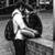 Black-and-white image of a couple embracing with text overlays on colorful and purple backgrounds.