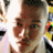 A 48x48 pixel buddy icon featuring a split composition with a person's face on the left and green text reading "Original Icons .com" on a dark green background on the right, displayed as part of an animated contact sheet.