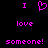 Pixelated text and heart symbol in bright pink on black background, arranged in three with 'I' above a heart, 'love' in the middle, and 'someone!' below