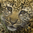 Pixelated close-up of a big cat's face on left, orange background with yellow text on right.