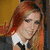 Four distinct views of a person with long red hair in a , showing different outfits and accessories against a yellow background