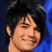Four identical pixelated headshots of a smiling person with dark hair against a blue background, each overlaid with white text on black bars.
