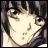 Anime-style character face with brown hair and green eyes, next to pixelated text on black background.