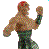 Pixelated figure with muscular build, raised right arm, and dark green lower body against gray background.