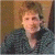 A pixelated image shows a person with light brown hair wearing a dark patterned top against a blurred background, next to green text reading "Original Icons .com" on a solid green field.