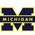Two versions of a pixelated 'M' logo with yellow outline and blue fill, one showing repeated text across the middle, the other without.