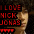 A pixelated image of a person with curly hair, featuring red text and heart symbols on the left side.