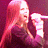 A split-frame animated contact sheet showing a pixelated singer with long pink hair holding a microphone on the left and green text reading "Original Icons .com" on a dark background on the right.