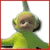 Pixelated green character with brown face, large ears, and a tall green antenna, wearing a green outfit against a white background with red border.