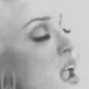 Black-and-white of repeated facial close-ups showing sequential mouth and eye expressions in a arrangement