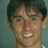 Static 48x48 pixel buddy icon showing a close-up of a person's face with dark hair and light skin, smiling broadly against a muted teal background.