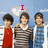 Three people stand side-by-side against a blue sky background with white clouds; the central figure has an arm around the left figure. Text above them changes from "I" to "luv" to "mas brothe".
