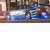 Pixelated image of a silver sports car with blue accents on dark background, below text reading 'Nissan Sky Line' in gradient purple-pink font.