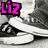 Pixelated grayscale image of a person's lower legs and feet in sneakers, with pink text 'Liz' on left and pink heart symbol on right.