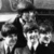A black-and-white contact sheet of two animated frames showing a pixelated character and The Beatles logo with silhouettes.