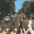 Pixelated contact sheet of two animated frames showing a group of figures walking with text "THE BEATLES" overlaid on the right frame.