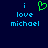 Pixelated blue text 'i love michael' on dark blue background with green heart symbol above 'i' on left side.