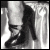 A black-and-white animated sequence shows a figure walking with text overlay that reads "I could walk all over U" in pixelated font.