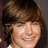 A pixelated image of a person with brown hair and a light-colored top, split into four quadrants with pink and gray backgrounds and white text.