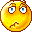 Pixelated yellow circular face with blue eyes and brown eyebrows showing multiple expressions including neutral, sad, open-mouthed, and squinting across a
