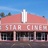 Pixelated image of a building with a red roof and white sign reading 'STAR CINEMA' under a blue sky.