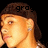 Pixelated close-up of a person with light brown hair and an earring, showing partial face against black background.